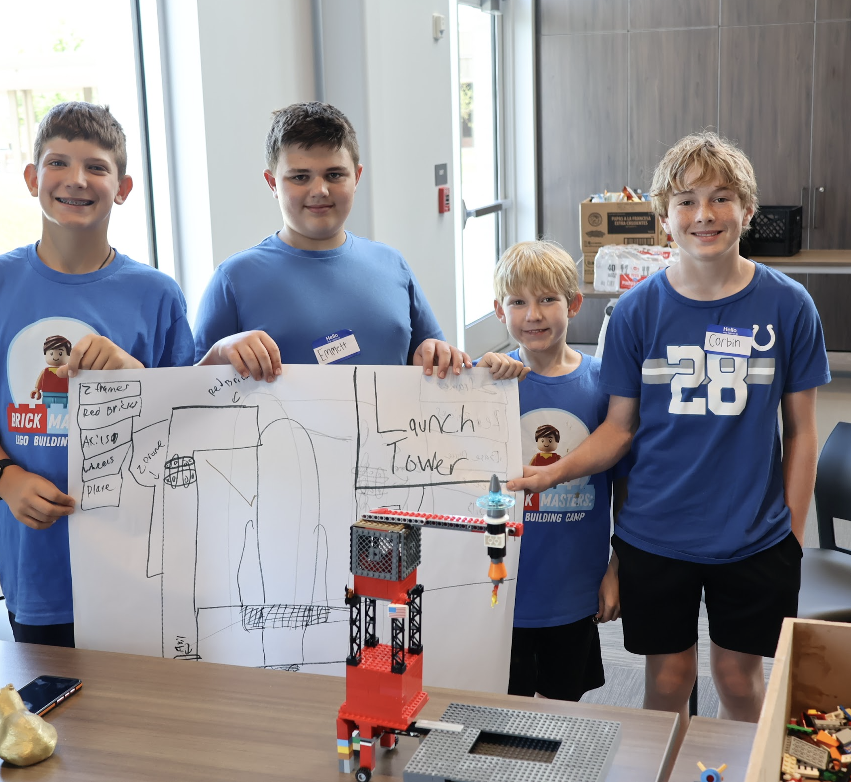 Students build with LEGO bricks during Brick Masters camp