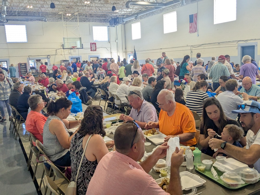 Crowd enjoying dinner at the 2025 St. Anthony of Padua Labor Day Festival in Morris
