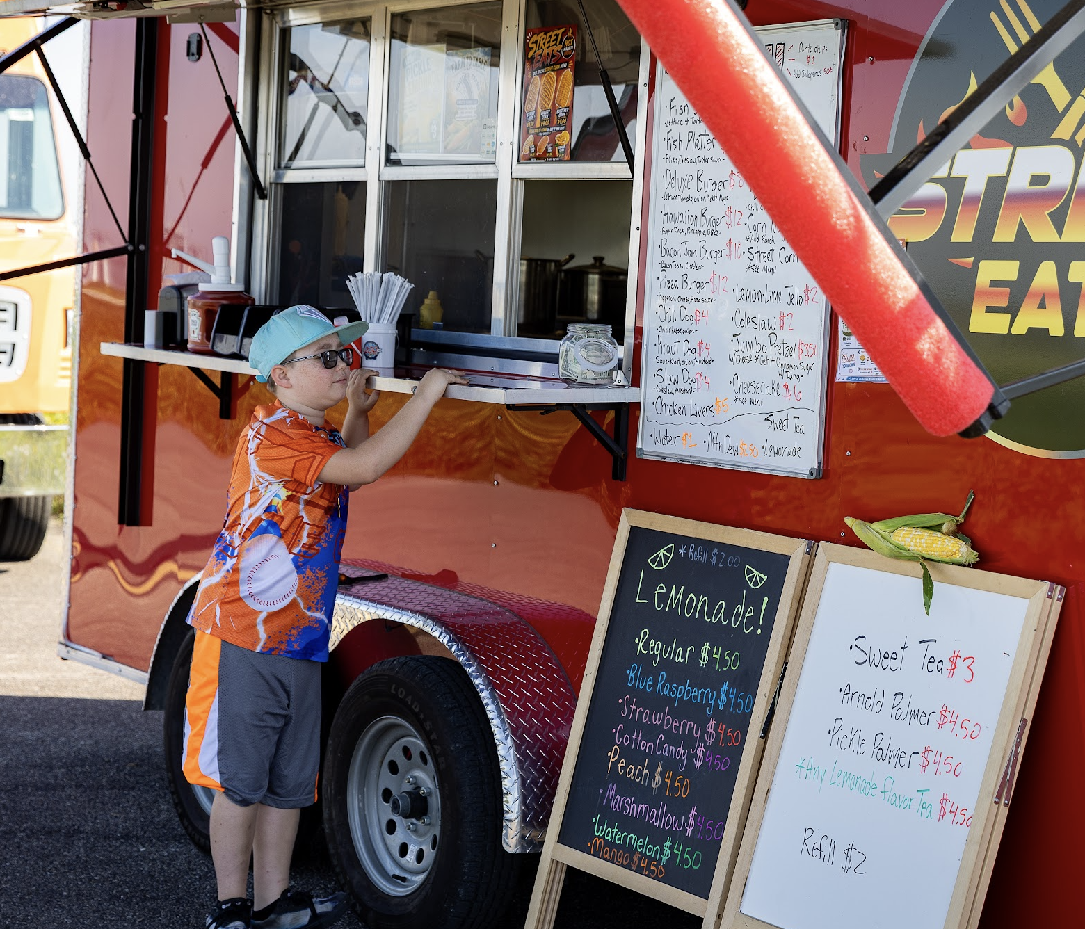 A young attendee visits a food trailer at the inaugural Runway Classic.