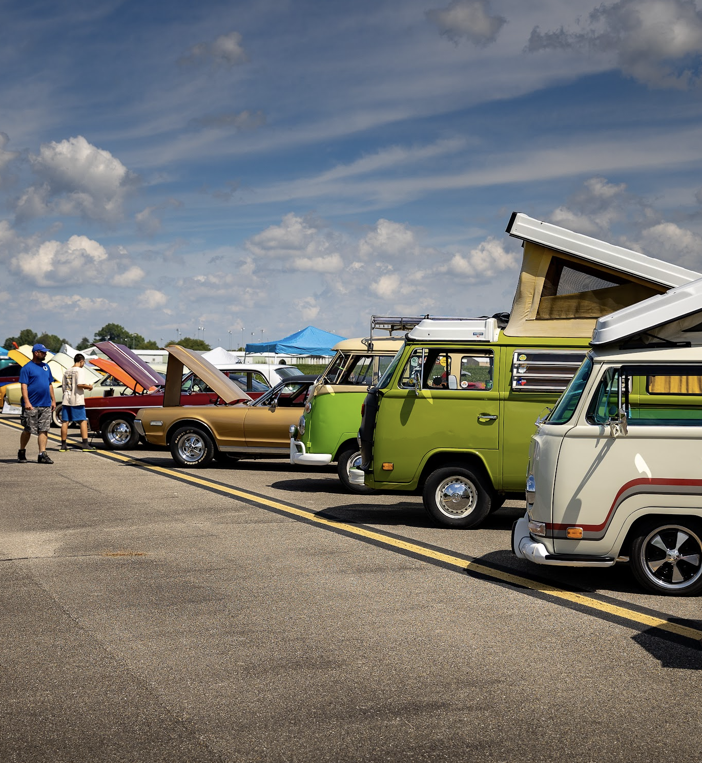Classic cars and Volkswagen camper vans displayed at the Runway Classic.